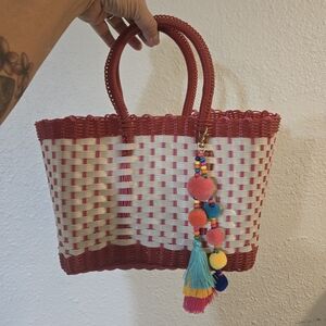 Red and White Woven Tote Bag with Pom Pom Charm